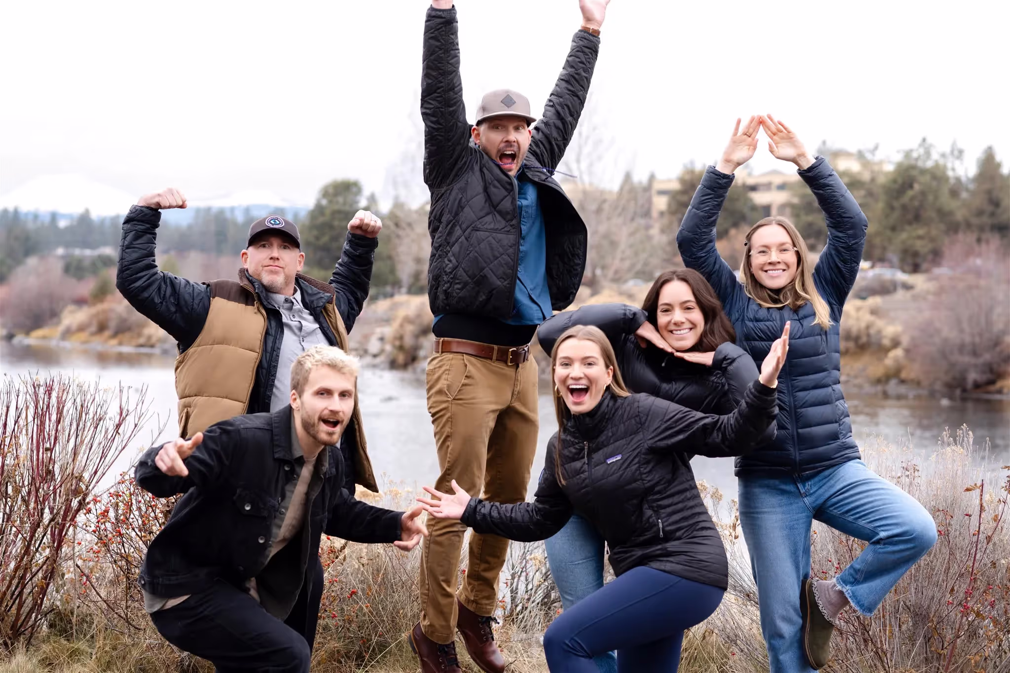 The team of web designers doing funny poses for a group photo shot by Miranda Kelton Photography.